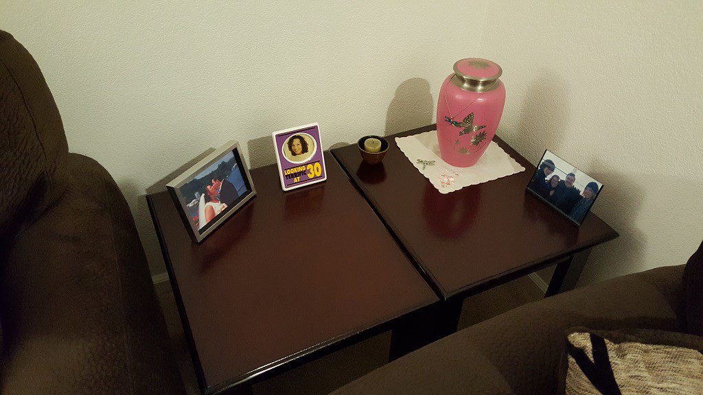 In the corner is her urn and some photos. This is where her desk used to sit.