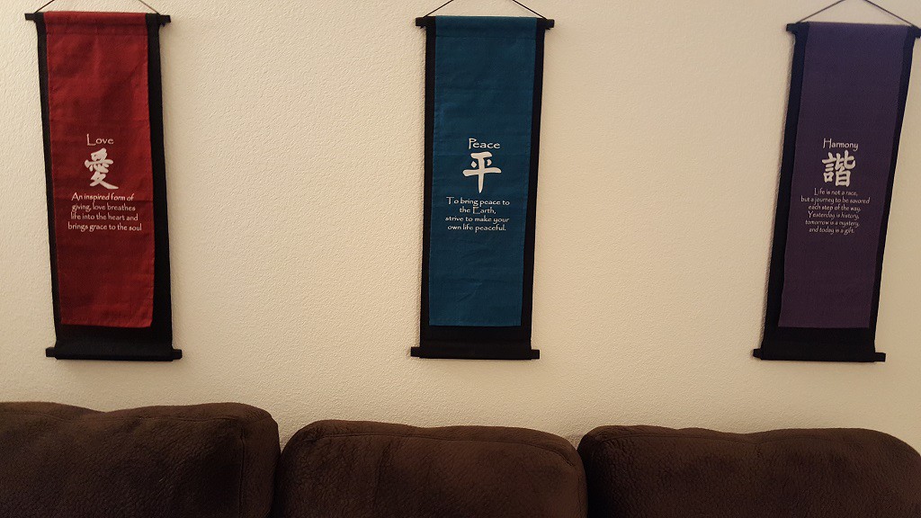 Here is a close-up of the three banners that we hung up behind the couch. One under each window.
